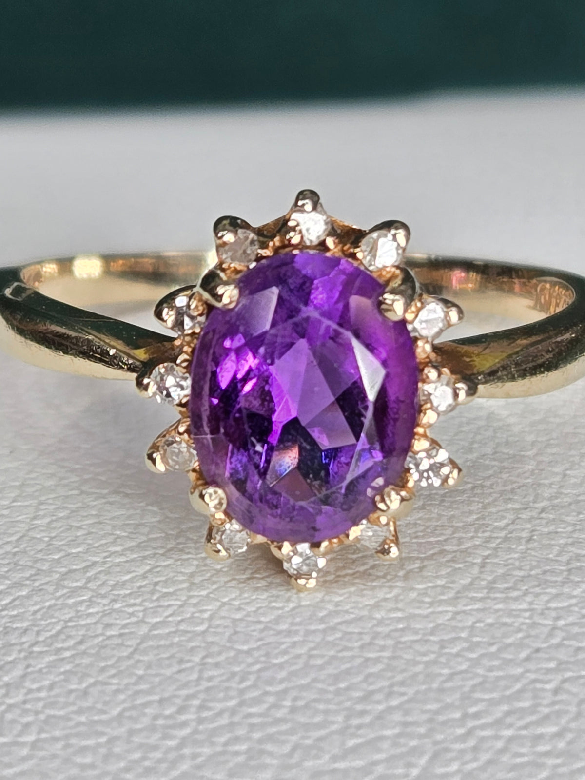 top view of amethyst and diamond halo ring