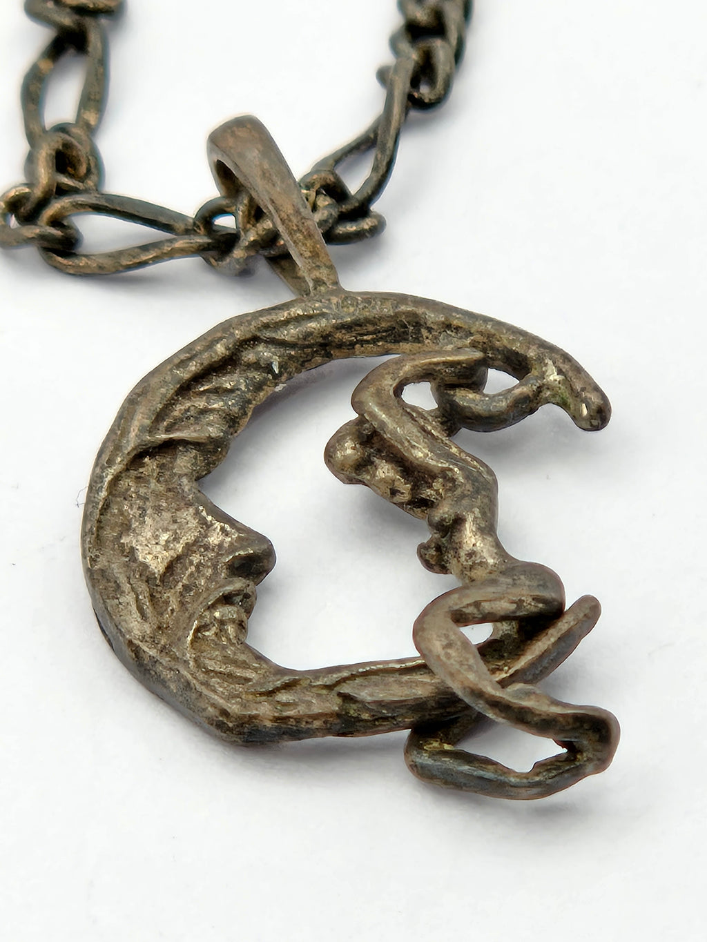 angled close-up of pendant relief and bail