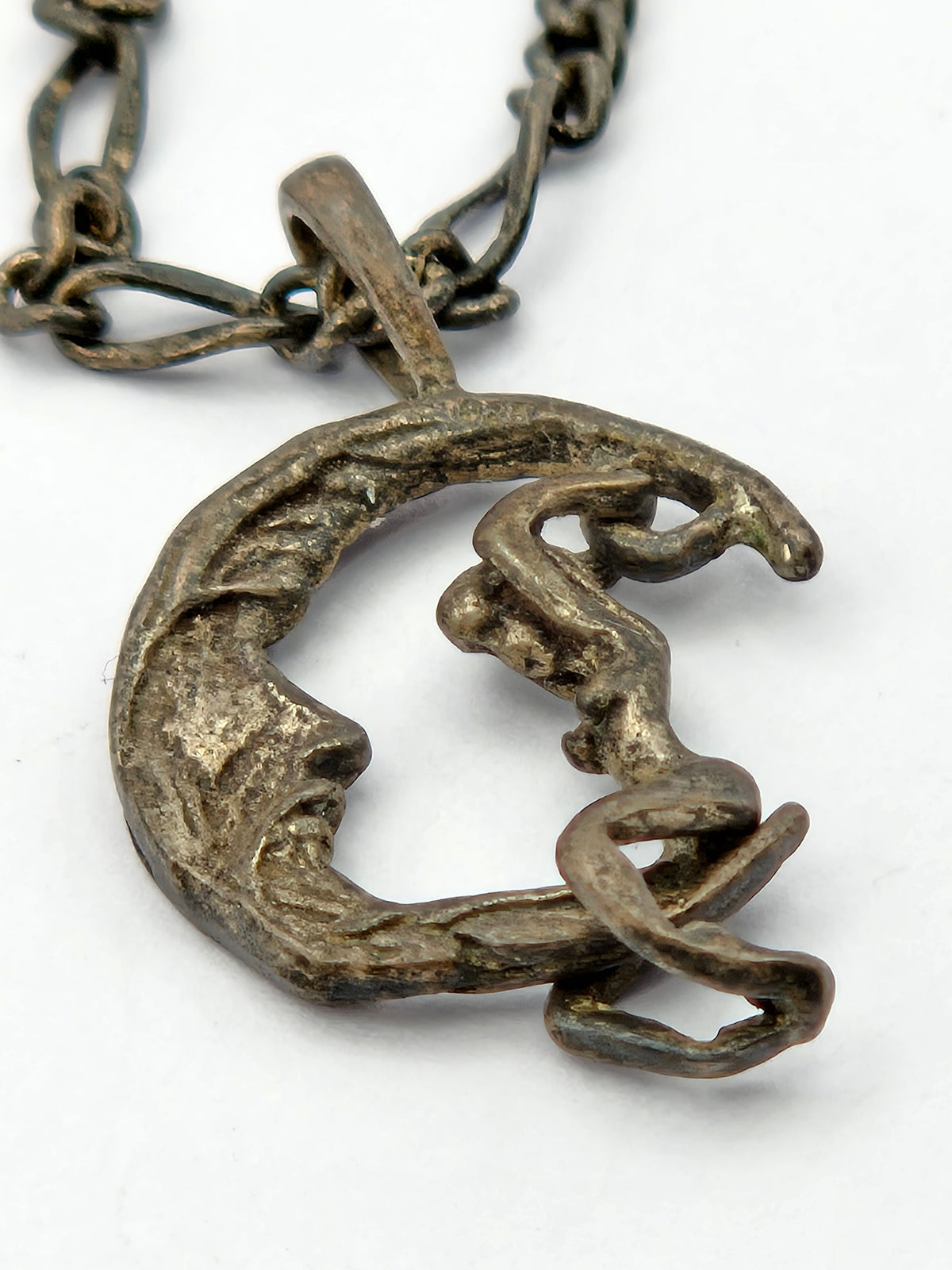 angled close-up of pendant relief and bail
