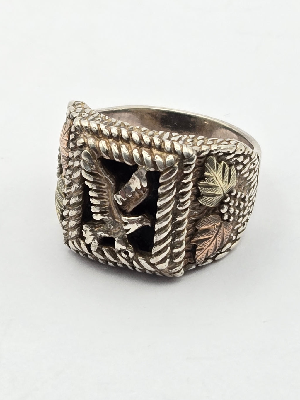 Vintage Coleman Black Hills ring with onyx eagle motif and 12k gold accents.