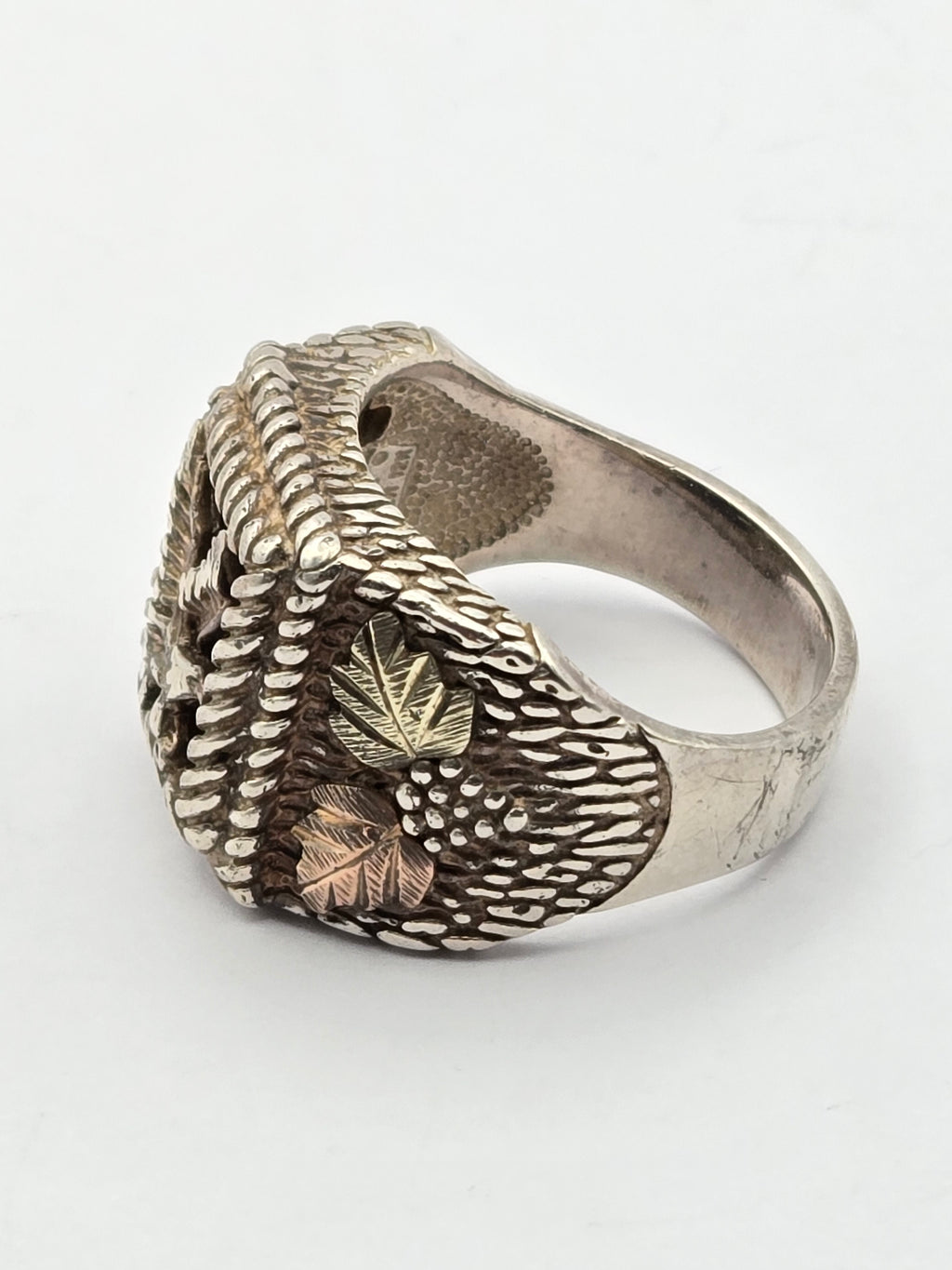 top view of onyx eagle ring with gold leaf accents