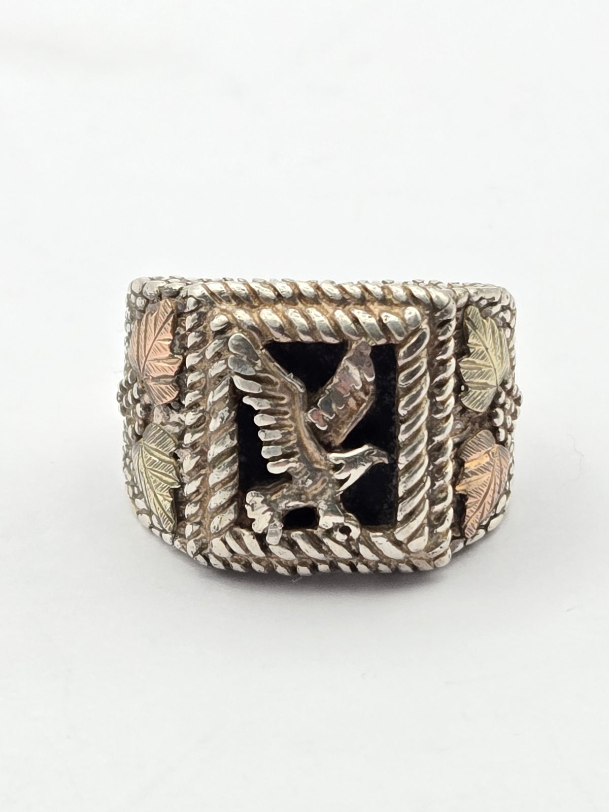 side view showing layered metalwork and shank detail