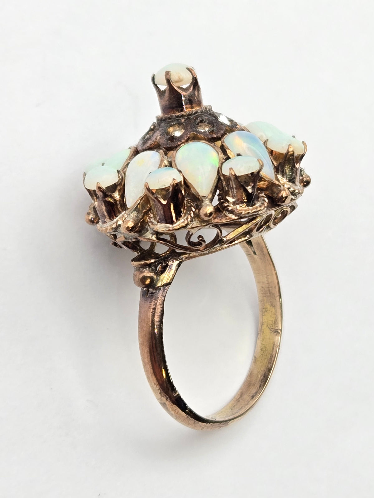 macro detail of filigree scrollwork around opal