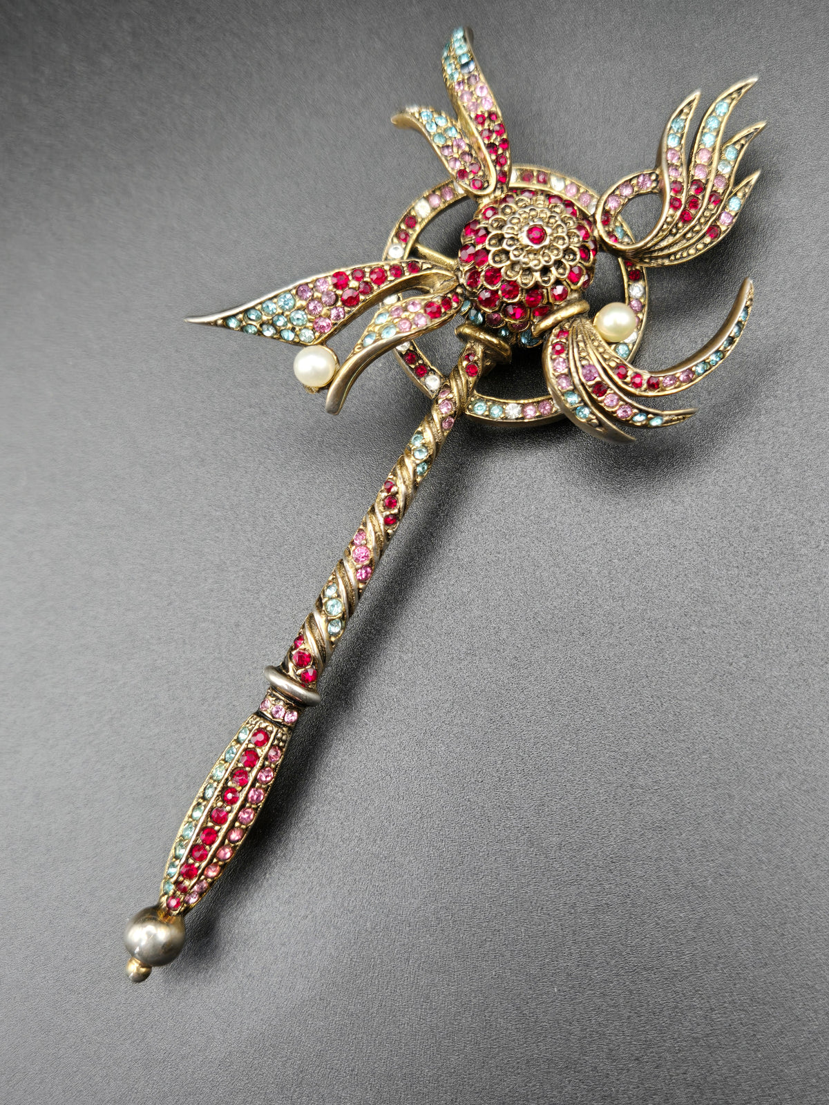 angled detail of brooch center and rhinestone accents
