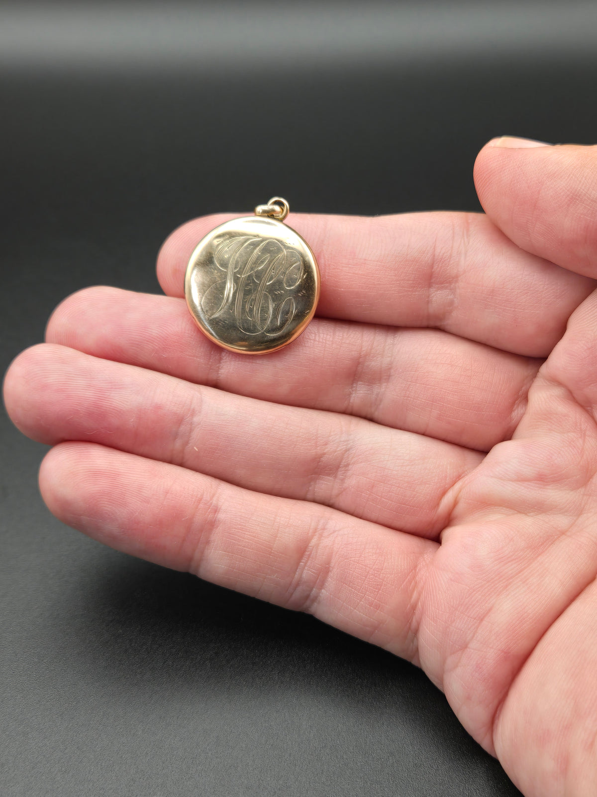 back of locket showing monogram and exterior engraving