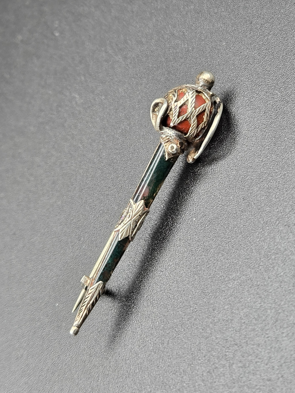brooch shown flat highlighting jasper and bloodstone cabochons