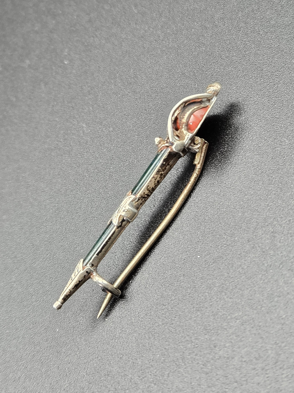 angled close-up of silver filigree and stone settings