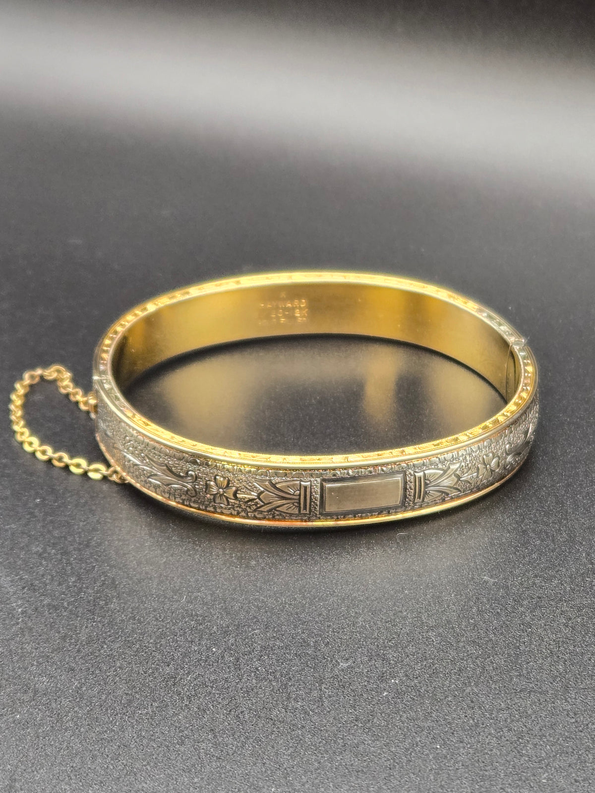 1920s Walter Haywood gold filled bangle bracelet, front view of etched design.