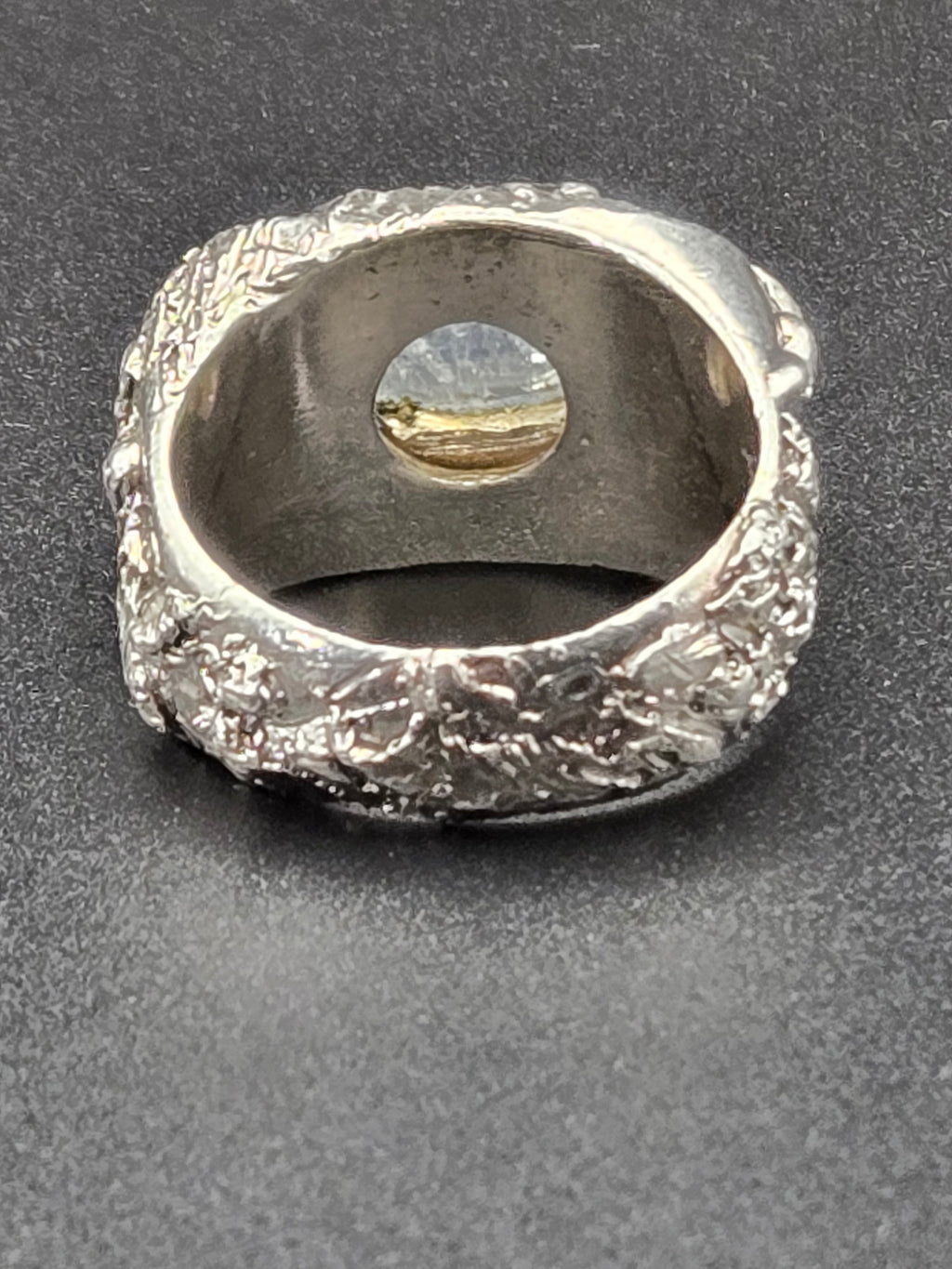 ring on model hand showing scale and sculptural band