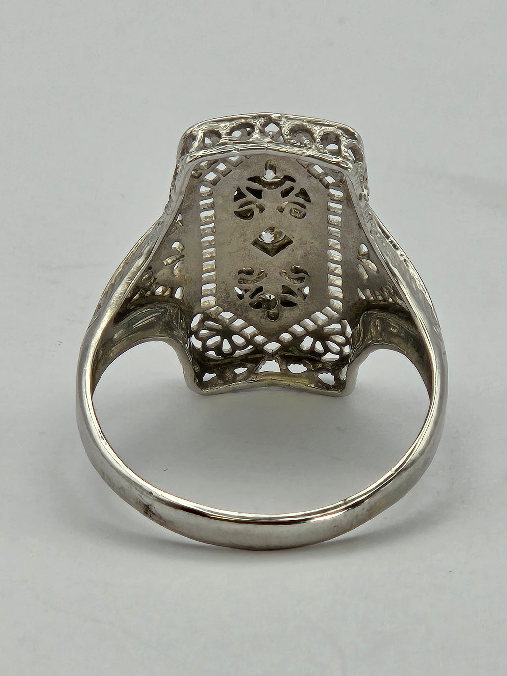 close-up of center diamond with surrounding milgrain