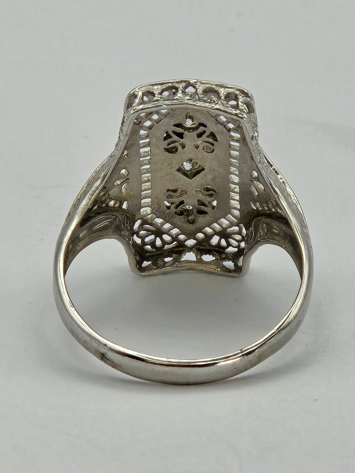close-up of center diamond with surrounding milgrain