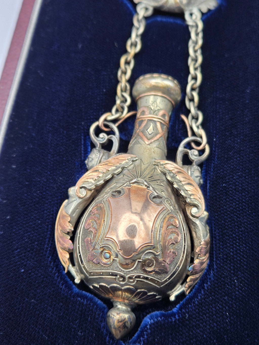 open bottle detail highlighting stopper and engraved motif