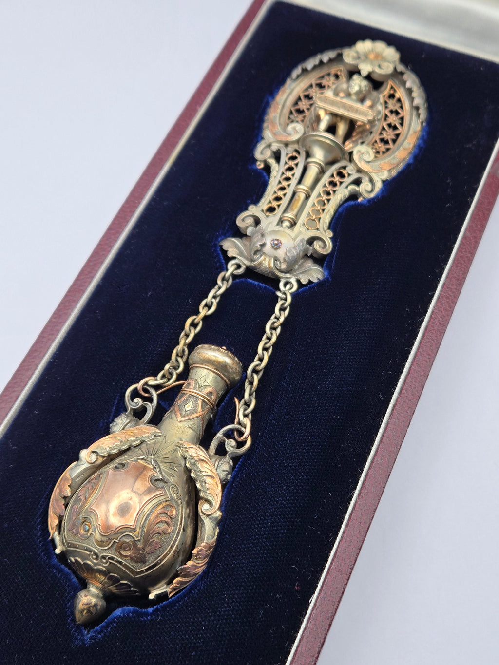 front view of Victorian chatelaine perfume bottle with cherub motif