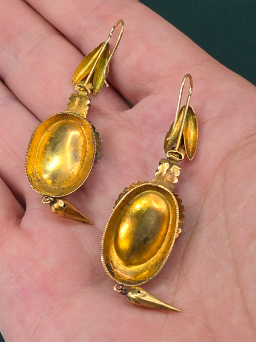Antique 18k gold Victorian garnet earrings, detail view of filigree and stone setting.