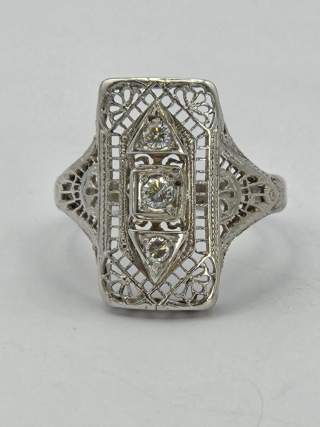 angled shot of ring highlighting diamond cuts and mounting