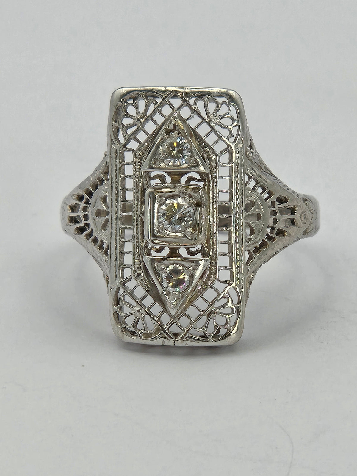 angled shot of ring highlighting diamond cuts and mounting